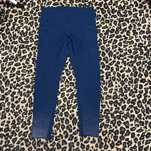 Navy Blue Lululemonsize 6 compression leggings with detail on the ankle